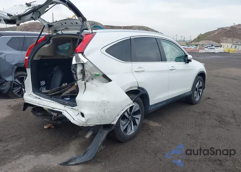 2016 Honda Cr-V Touring z USA, uszkodzony, nr VIN 5J6RM4H98GL140550